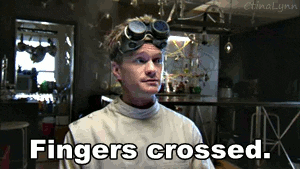 Doctor Horrible crossing fingers, captioned with &quot;Fingers crossed&quot;