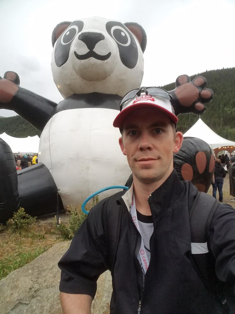man and giant inflatable panda