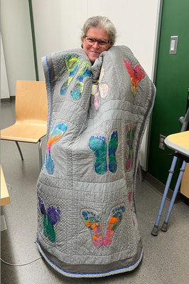 Wrapped in my Community quilt.